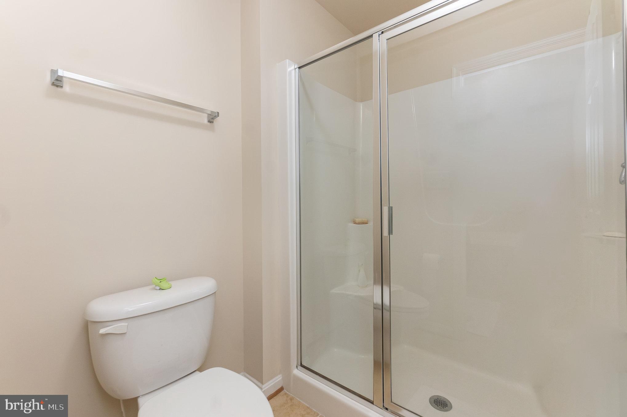 4711 Wensel Road Fredericksburg, VA 22408 - Photo 19 of 33 a white toilet sitting next to a shower