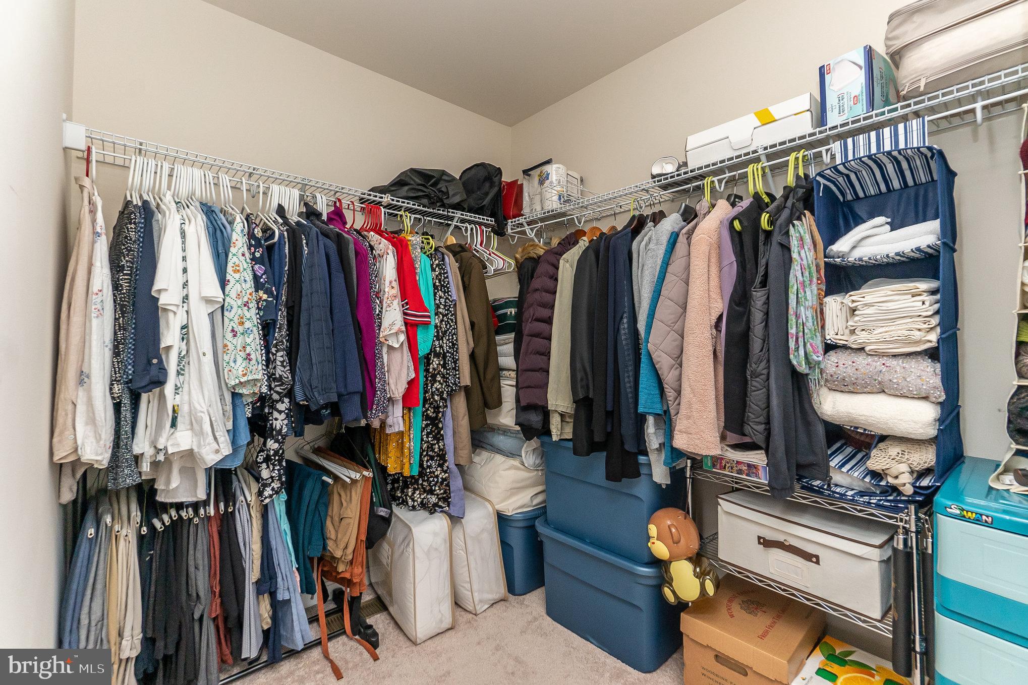 4711 Wensel Road Fredericksburg, VA 22408 - Photo 21 of 33 a view of walk in closet with clothes and shoes