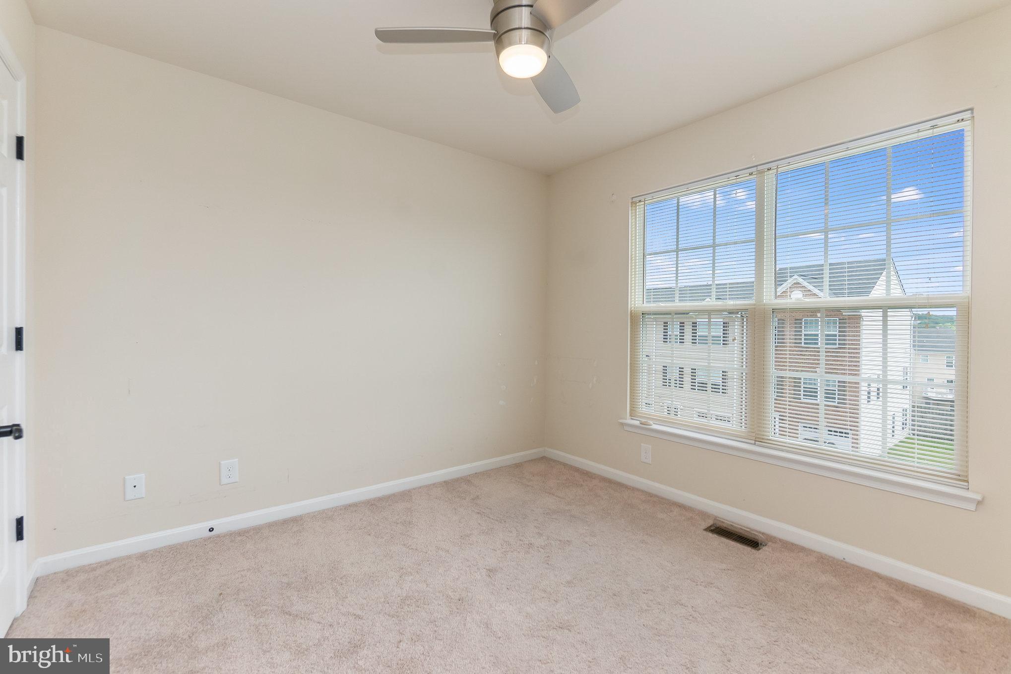 4711 Wensel Road Fredericksburg, VA 22408 - Photo 24 of 33 an empty room with a empty space and windows