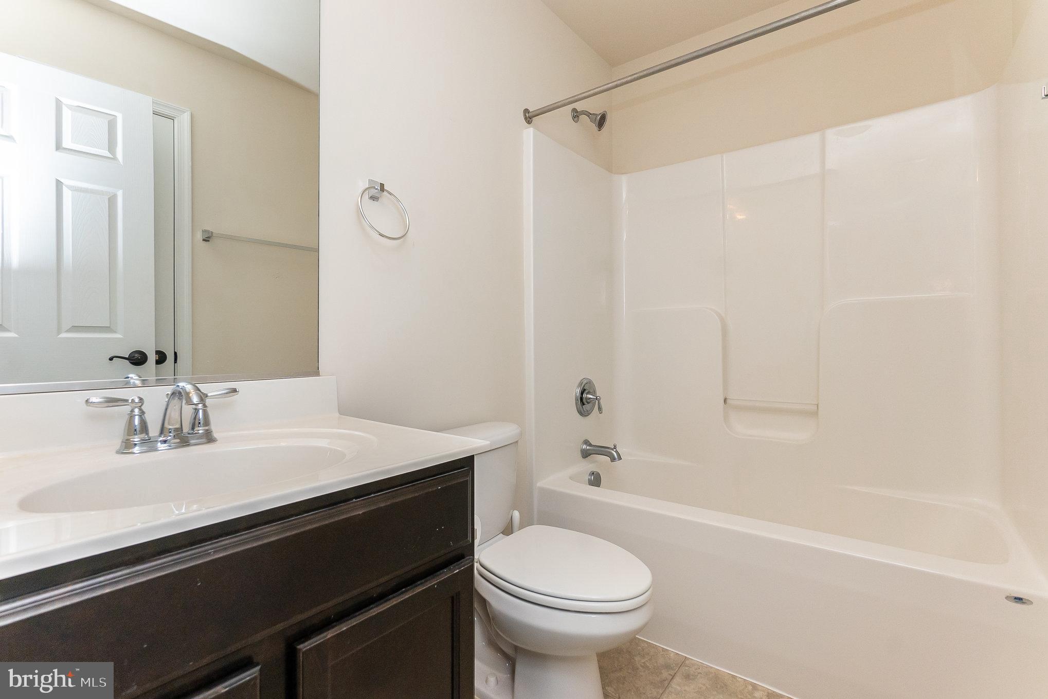 4711 Wensel Road Fredericksburg, VA 22408 - Photo 28 of 33 a bathroom with a sink a toilet and shower