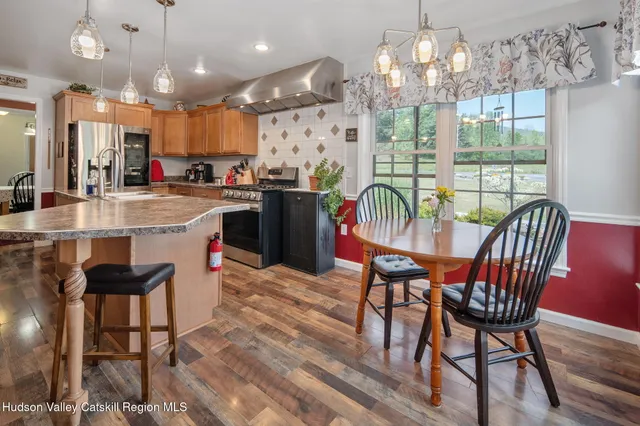 a view of room with workspace and windows