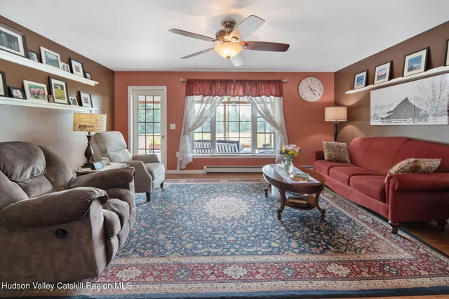 a room with furniture a lamp and a window