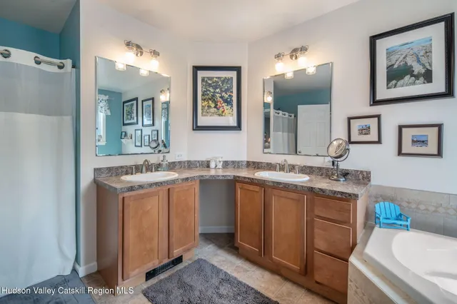 an aerial view of a house with swimming pool garden and mountain view