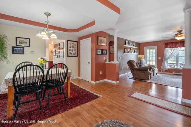 a kitchen with kitchen island granite countertop a sink stove and cabinets
