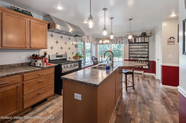 a bedroom with furniture and a chandelier