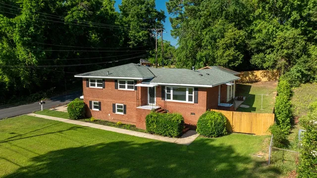 a front view of a house with a yard