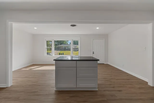 a view of kitchen with wooden floor