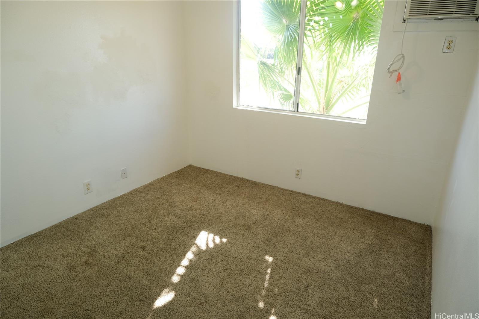 91-1020 Hoomaka Street, Unit 88 Ewa Beach, HI 96706 - Photo 12 of 22 an empty room with a window