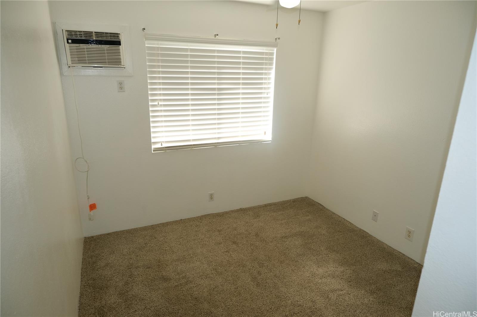 91-1020 Hoomaka Street, Unit 88 Ewa Beach, HI 96706 - Photo 14 of 22 an empty room with a window