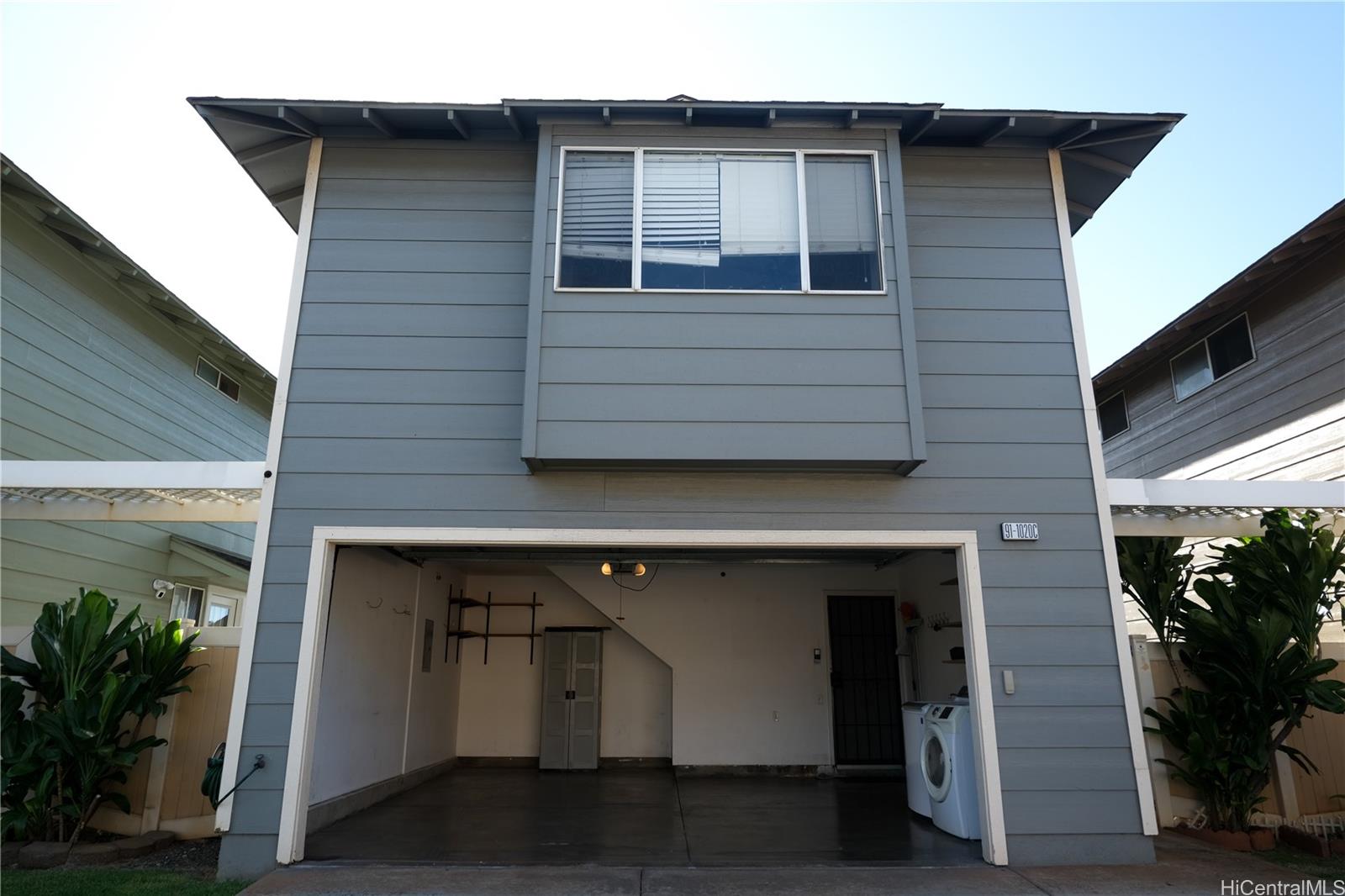 91-1020 Hoomaka Street, Unit 88 Ewa Beach, HI 96706 - Photo 21 of 22 a front view of a house with plants