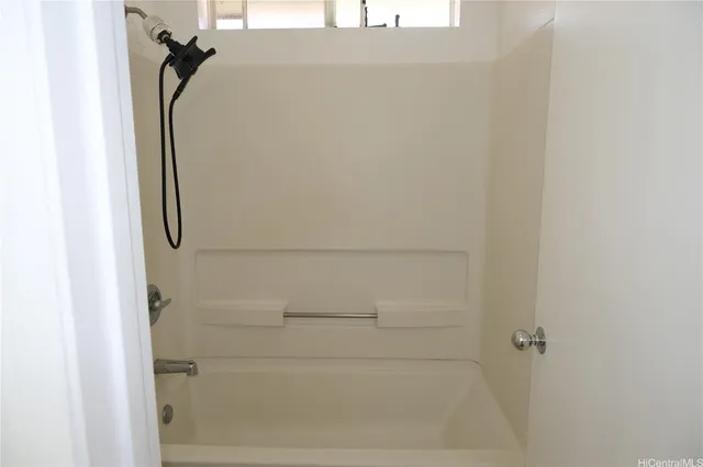 a bathroom with a glass shower door
