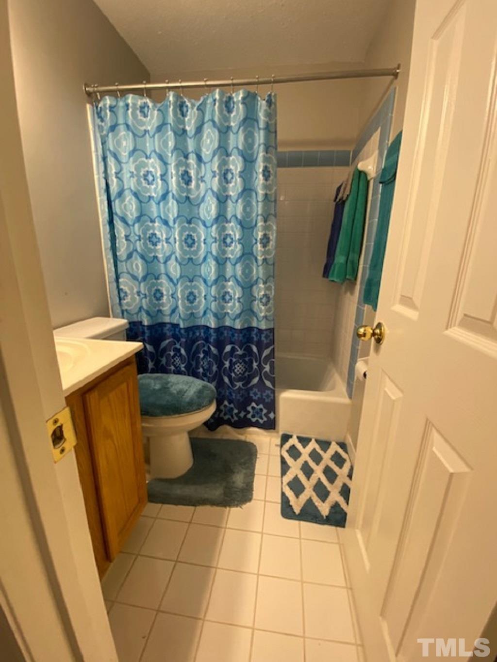 141 Jones Franklin Road, Unit H Raleigh, NC 27606 - Photo 27 of 36 a bathroom with a toilet and shower