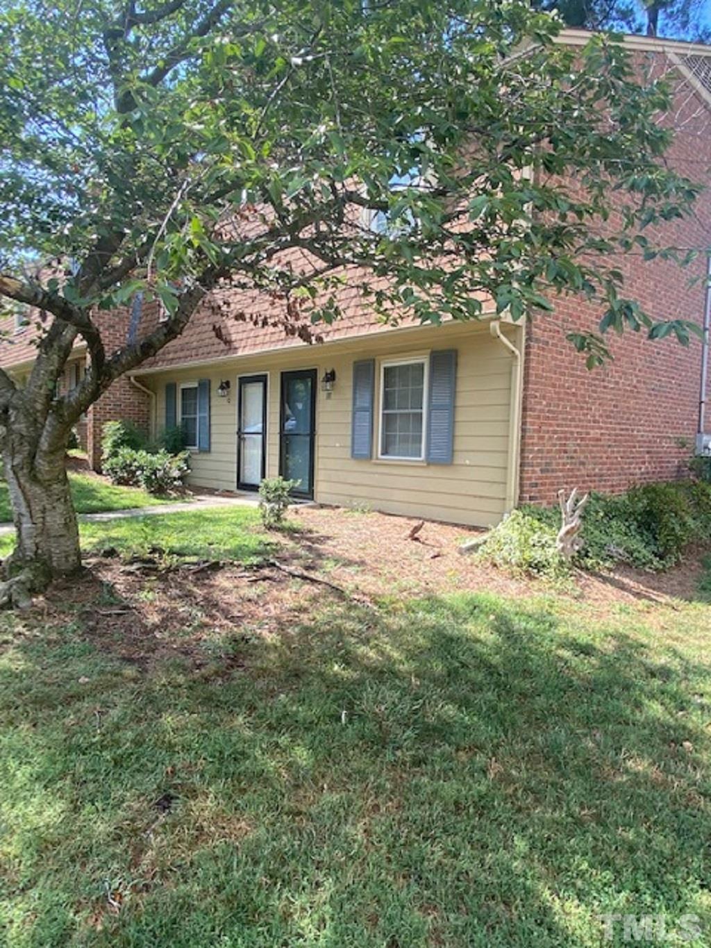 141 Jones Franklin Road, Unit H Raleigh, NC 27606 - Photo 3 of 36 a front view of a house with garden