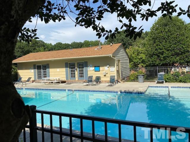 141 Jones Franklin Road, Unit H Raleigh, NC 27606 - Photo 31 of 36 a view of a house with swimming pool and sitting area