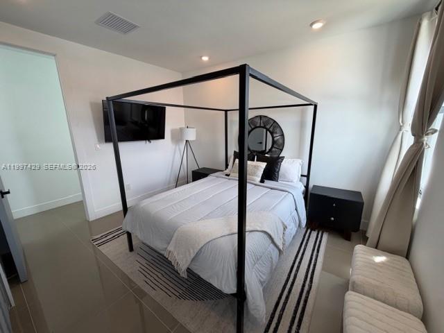 3645 Southwest 3rd Street Miami, FL 33135 - Photo 12 of 23 a bedroom with a bed and a mirror