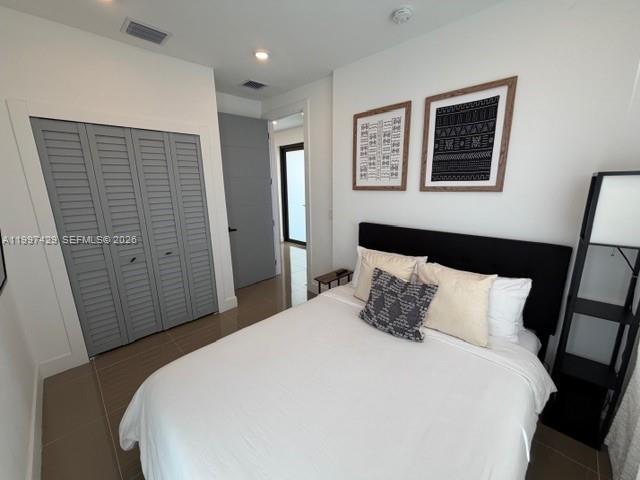 3645 Southwest 3rd Street Miami, FL 33135 - Photo 16 of 23 a bedroom with a bed and a walk in closet