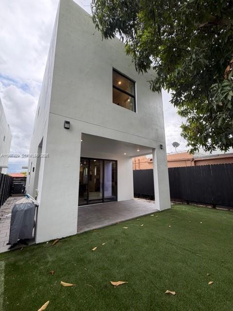 3645 Southwest 3rd Street Miami, FL 33135 - Photo 19 of 23 a view of a backyard of the house