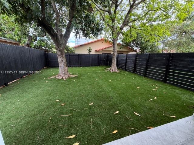 3645 Southwest 3rd Street Miami, FL 33135 - Photo 23 of 23 a view of a backyard with a tree