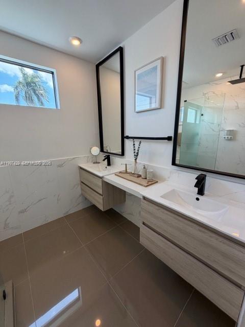 3645 Southwest 3rd Street Miami, FL 33135 - Photo 10 of 23 a bathroom with a double vanity sink and mirror