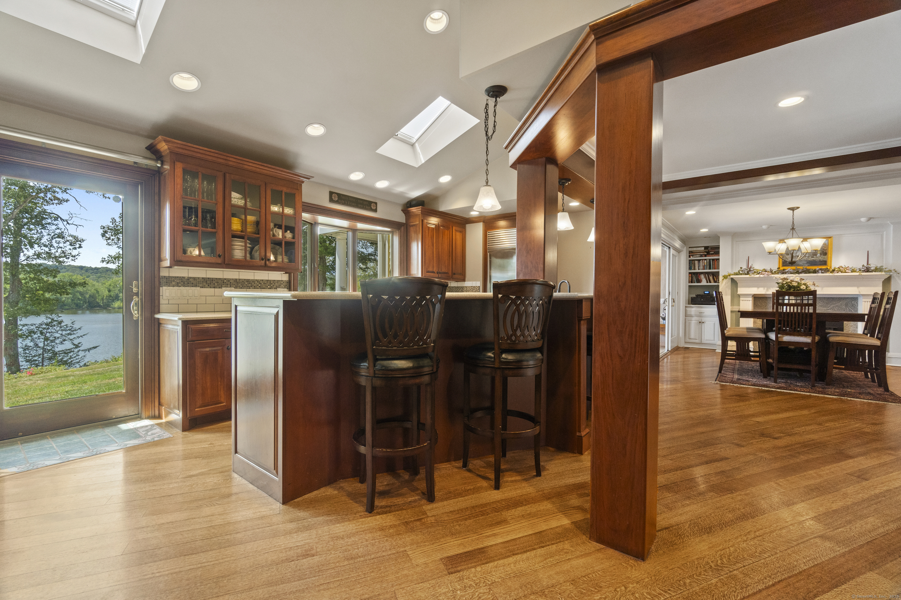 291 Injun Hollow Road Haddam, CT 06424 - Photo 13 of 30 a dining hall with stainless steel appliances kitchen island granite countertop a refrigerator and cabinets