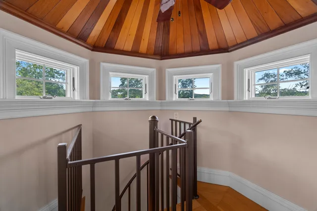 a front view of a house with yard and green space