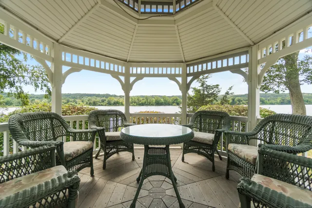an aerial view of a houses with ocean view