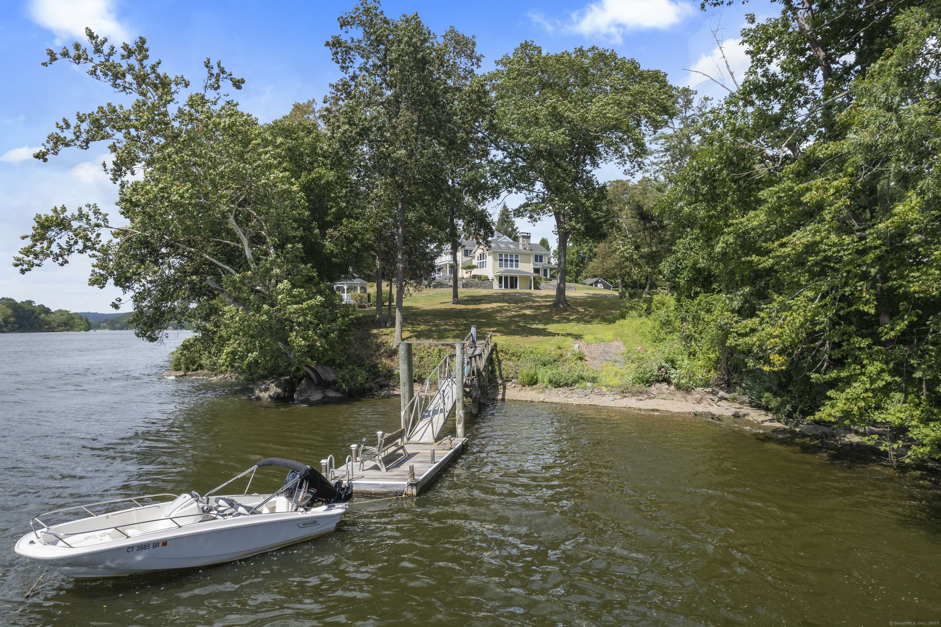 291 Injun Hollow Road Haddam, CT 06424 - Photo 3 of 30 a view of a lake with houses
