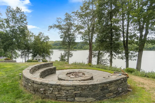 a view of a swimming pool with a yard