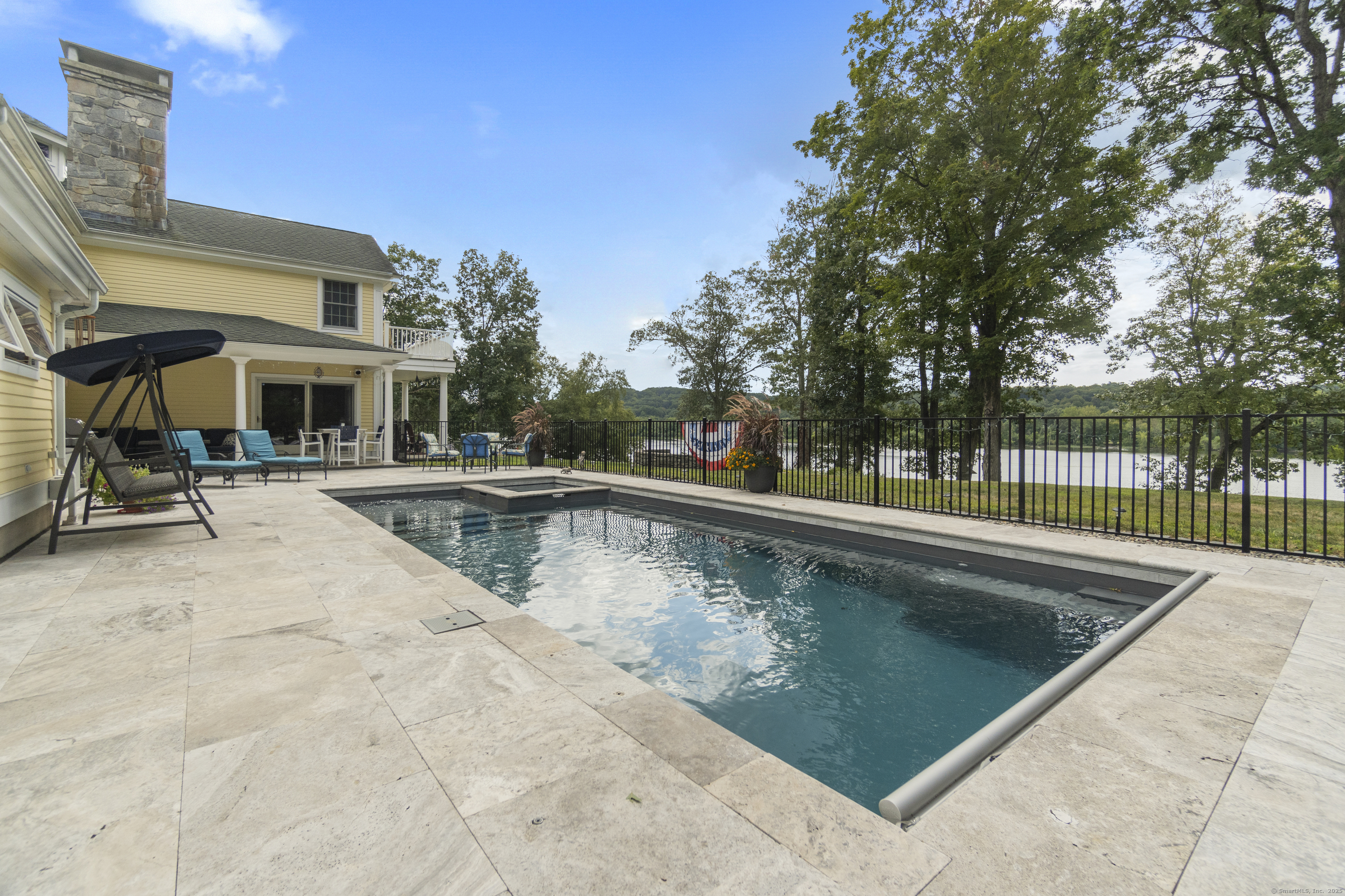 291 Injun Hollow Road Haddam, CT 06424 - Photo 9 of 30 a view of swimming pool with outdoor seating and lake view