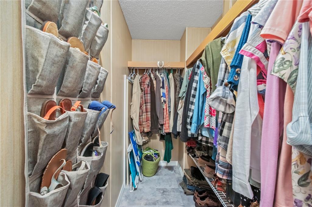 112 Magnolia Street Hawthorne, FL 32640 - Photo 23 of 41 a view of walk in closet with clothes