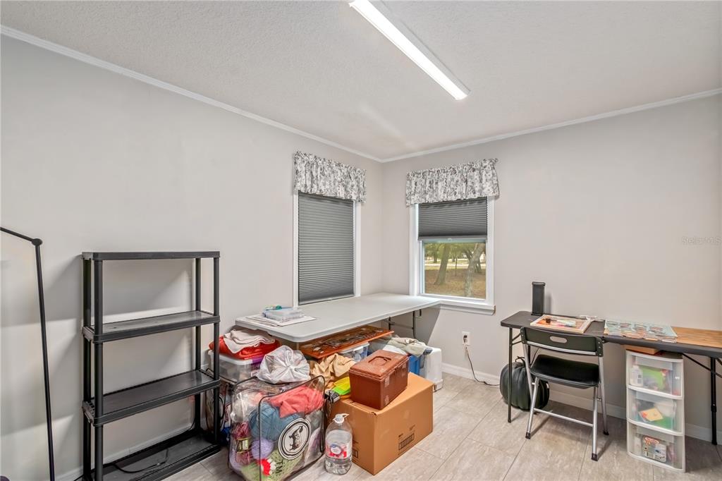 112 Magnolia Street Hawthorne, FL 32640 - Photo 24 of 41 a bedroom with a bed and a window