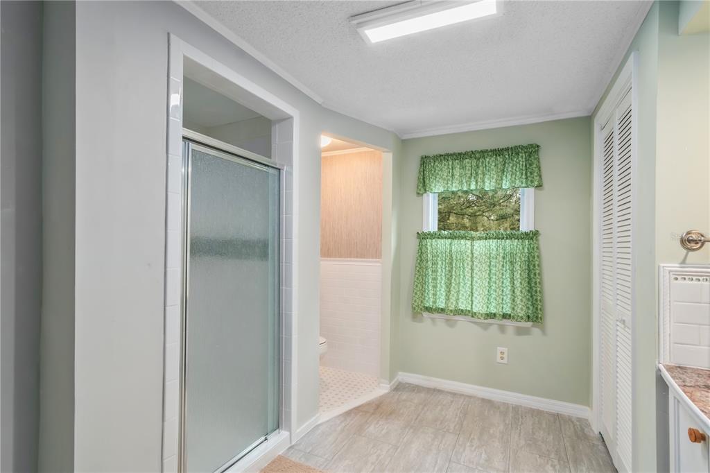 112 Magnolia Street Hawthorne, FL 32640 - Photo 26 of 41 a view of an empty room with wooden floor and a window