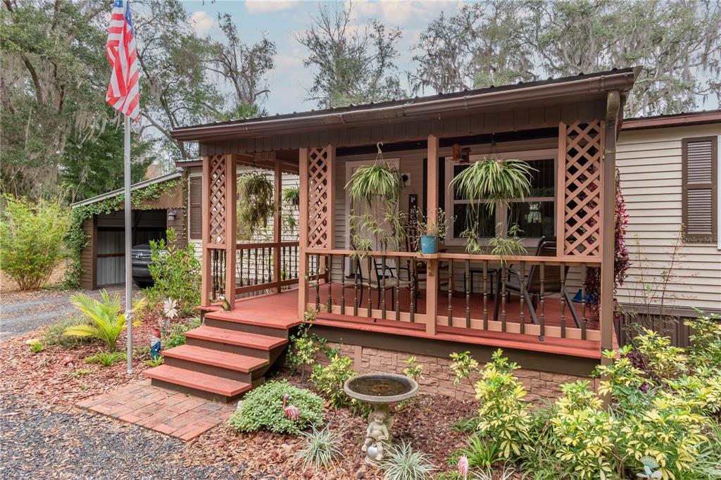112 Magnolia Street Hawthorne, FL 32640 - Photo 3 of 41 a view of a swimming pool with a deck