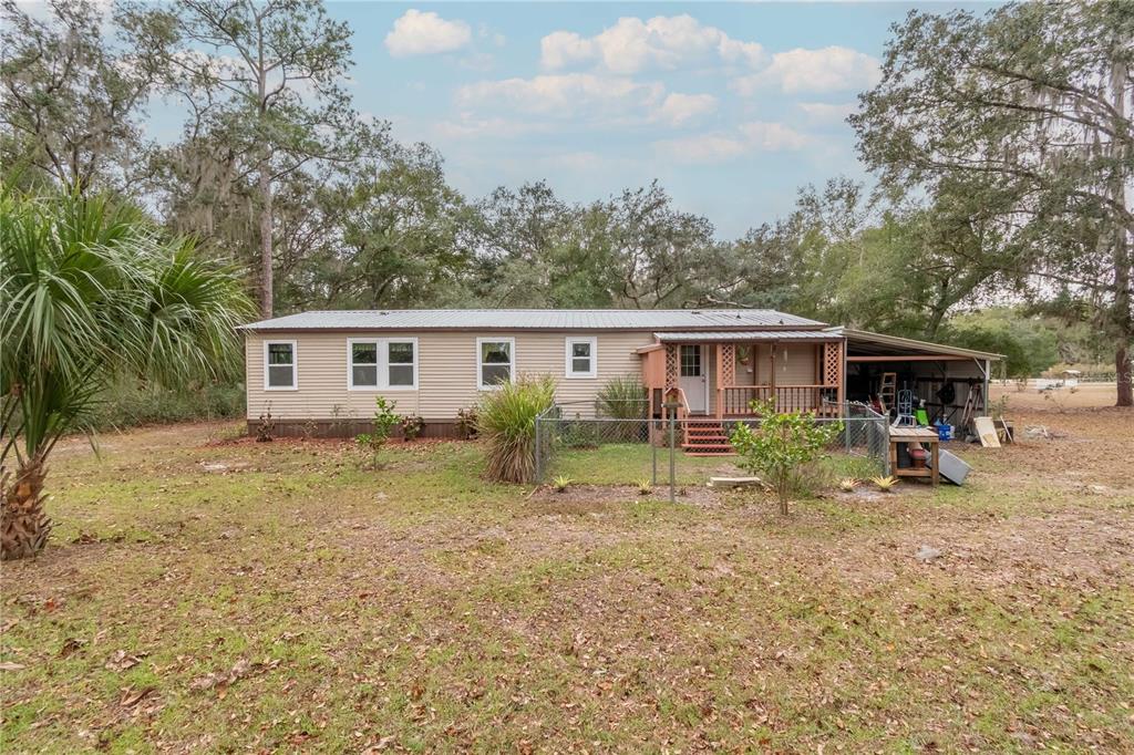 112 Magnolia Street Hawthorne, FL 32640 - Photo 32 of 41 a view of a house with backyard and sitting area