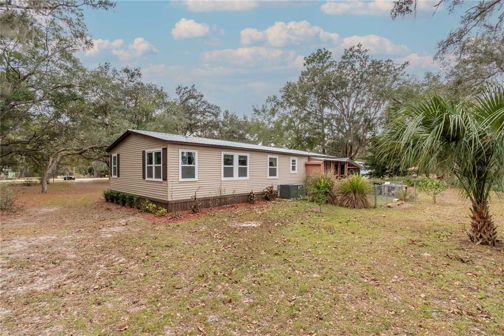 112 Magnolia Street Hawthorne, FL 32640 - Photo 34 of 41 a view of a house with a yard