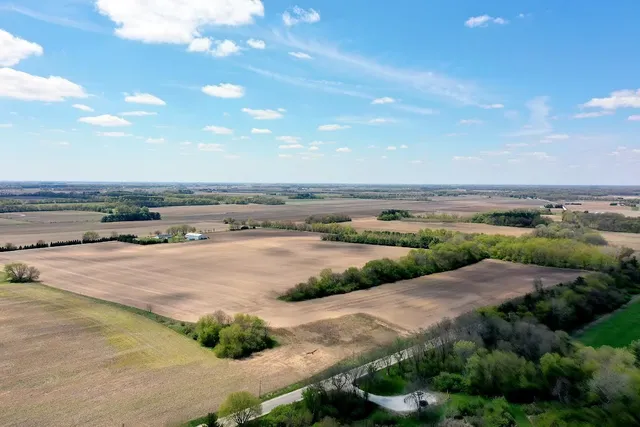 a view of a lake with beach and city view