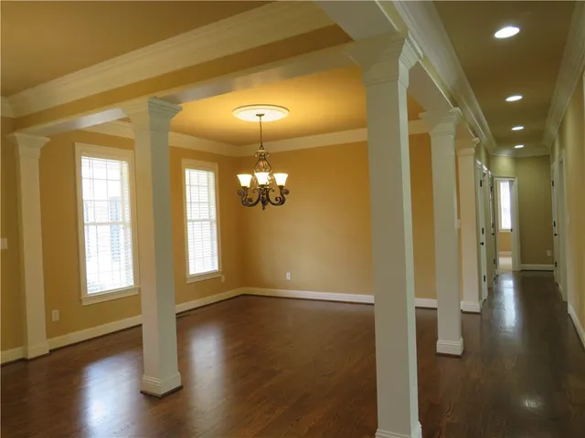 a view of livingroom and dining room with hardwood floor