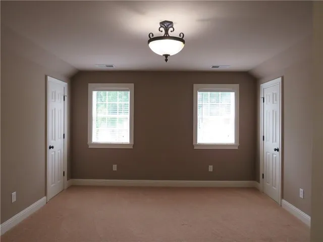an empty room with closet area