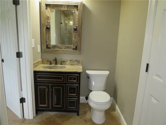 a view of room with a ceiling fan and window