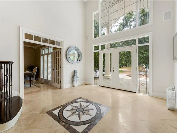 a kitchen with stainless steel appliances granite countertop a stove and white cabinets