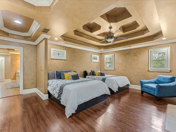 a kitchen with stainless steel appliances kitchen island granite countertop a table chairs sink and cabinets