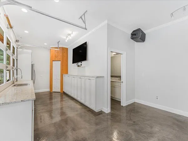 a spacious bathroom with a tub shower and window