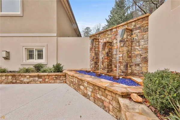 a view of a house with pool and a yard