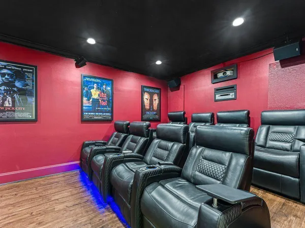 a spacious bedroom with a bed and ceiling fan