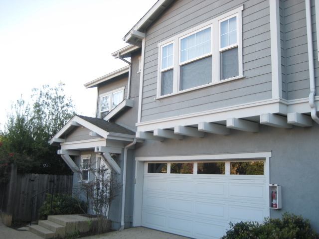 513 Coronel Place, Unit 6 Santa Barbara, CA 93101 - Photo 1 of 1 a front view of a house with a yard and wooden fence