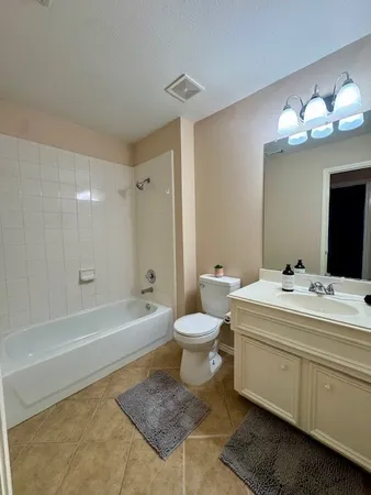 a bathroom with a sink a toilet and a bathtub