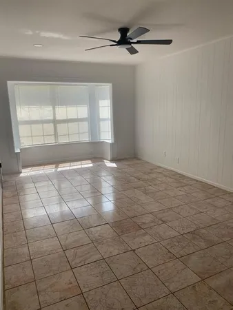 a view of an empty room and window