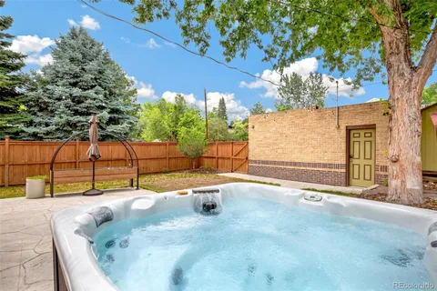 a view of a outdoor space with a patio and outdoor seating
