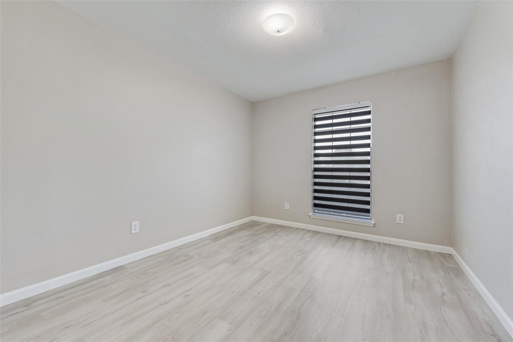 506 Pecos Path Drive Murphy, TX 75094 - Photo 14 of 19 a view of a room with wooden floor and window