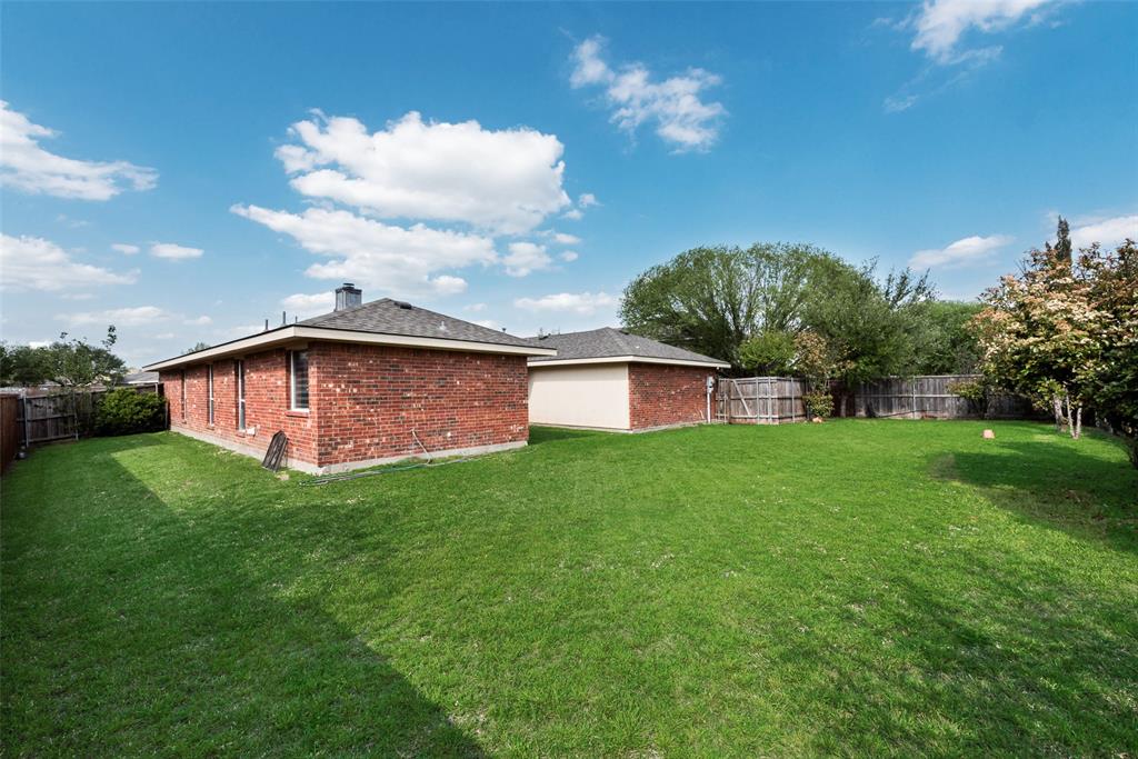 506 Pecos Path Drive Murphy, TX 75094 - Photo 19 of 19 a view of a backyard with a garden